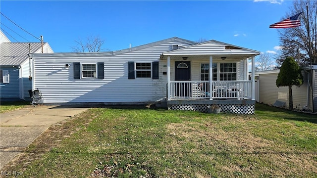 view of front of home featuring covered porch and a front yard