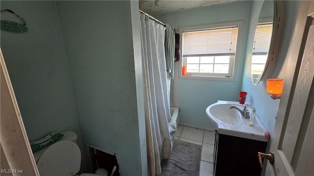 full bathroom with toilet, vanity, tile patterned floors, and shower / bath combo with shower curtain