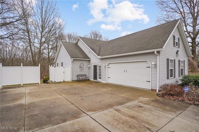 view of side of property with a garage