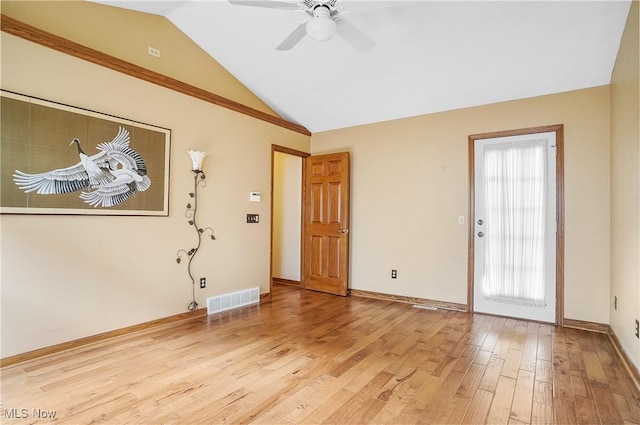 interior space with light hardwood / wood-style floors, vaulted ceiling, and ceiling fan