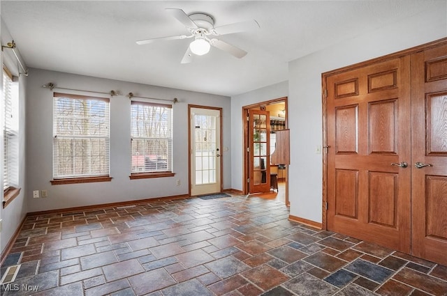 interior space featuring a wealth of natural light and ceiling fan