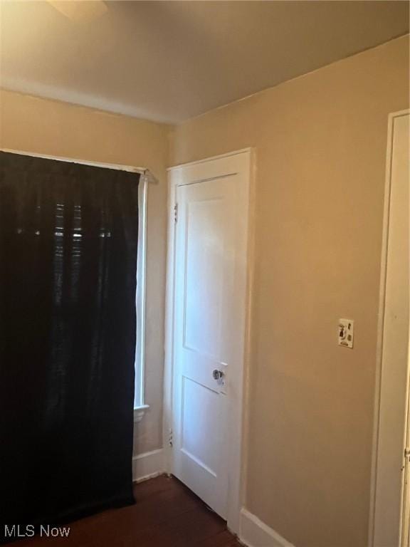 unfurnished bedroom featuring dark hardwood / wood-style floors