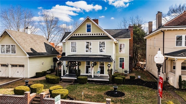 view of front of property featuring a porch and a garage