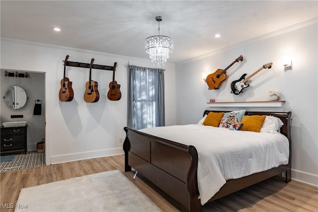 bedroom with a chandelier, light hardwood / wood-style floors, and crown molding