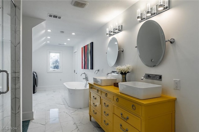 bathroom with washer / clothes dryer, vanity, and independent shower and bath