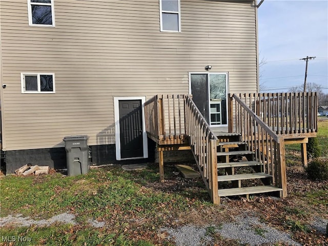 back of property featuring a wooden deck