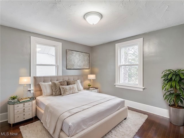 bedroom featuring dark hardwood / wood-style floors