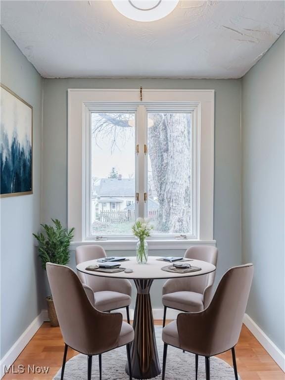 dining room featuring light hardwood / wood-style floors