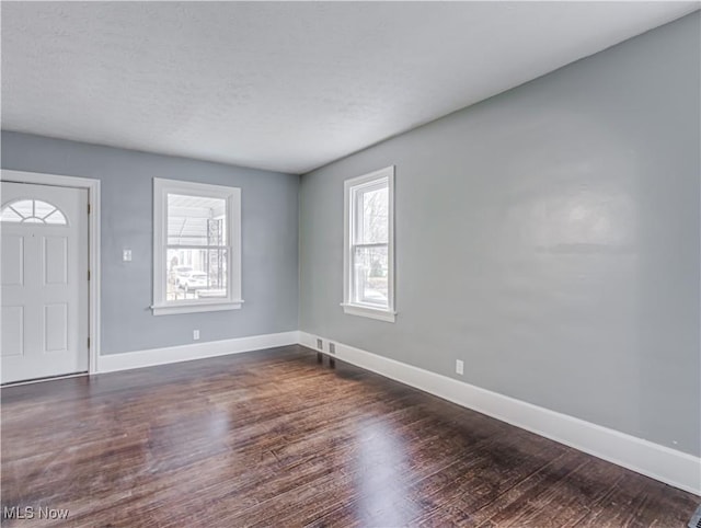 entrance foyer featuring dark hardwood / wood-style floors