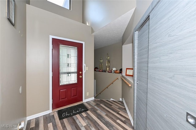 entrance foyer featuring plenty of natural light and hardwood / wood-style floors