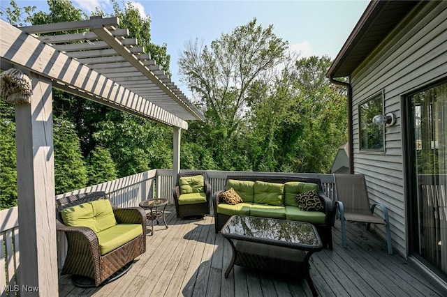 wooden deck featuring a pergola and an outdoor hangout area