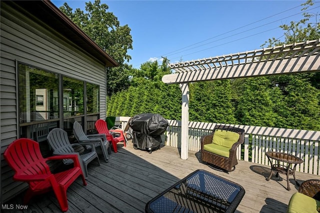 wooden deck featuring a grill