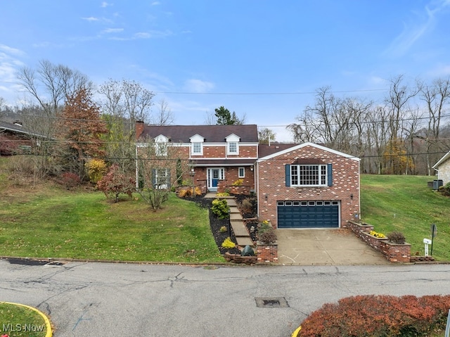 view of front of property with a front yard and a garage