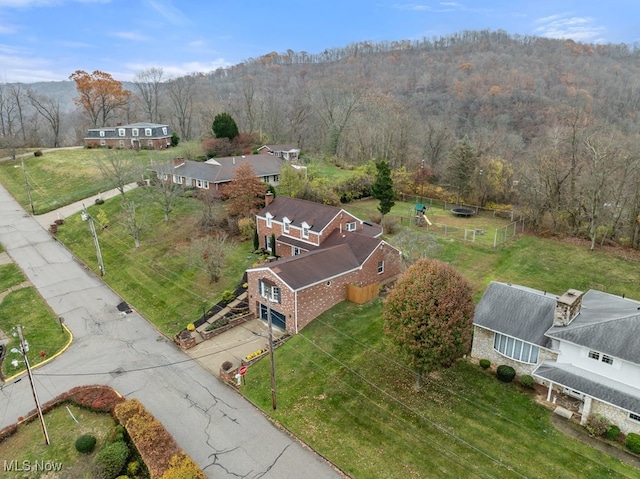 aerial view featuring a wooded view