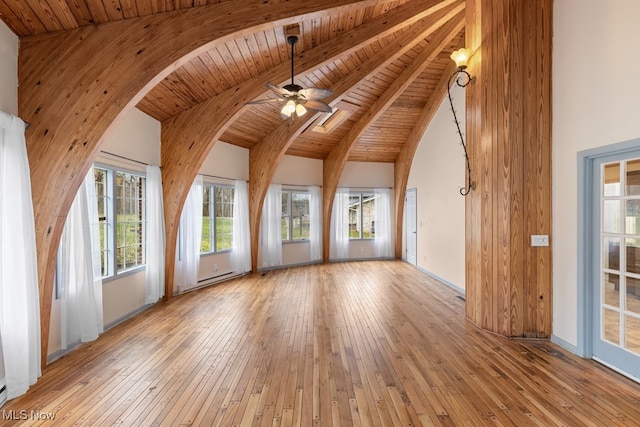 interior space featuring beam ceiling, ceiling fan, wooden ceiling, and light wood-type flooring