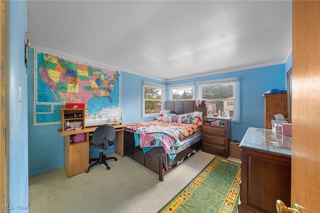 carpeted bedroom featuring crown molding