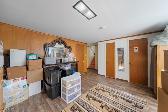 kitchen with dark hardwood / wood-style flooring and ornamental molding