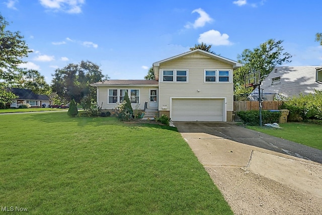 view of front of property featuring a garage and a front lawn