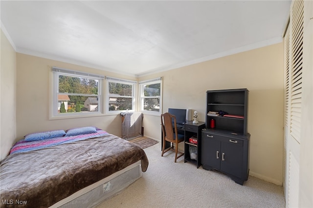 carpeted bedroom with crown molding