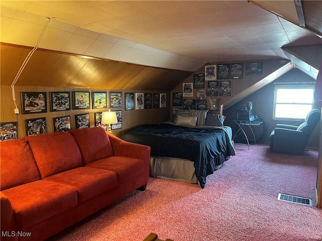 carpeted bedroom with vaulted ceiling