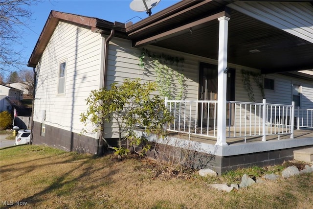 view of side of property with a porch