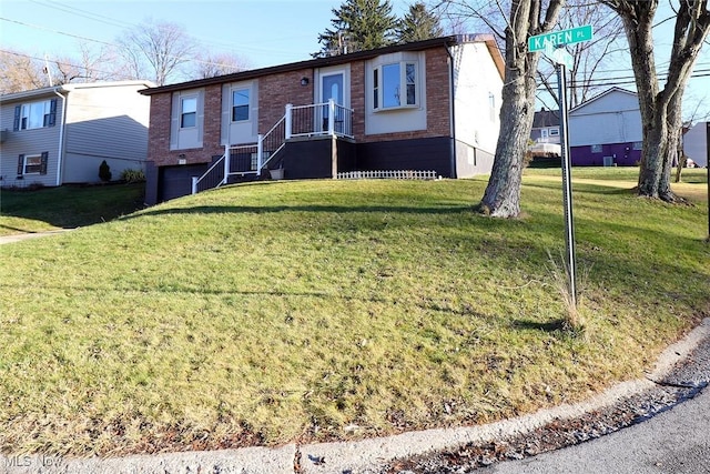 view of front of property featuring a garage and a front yard