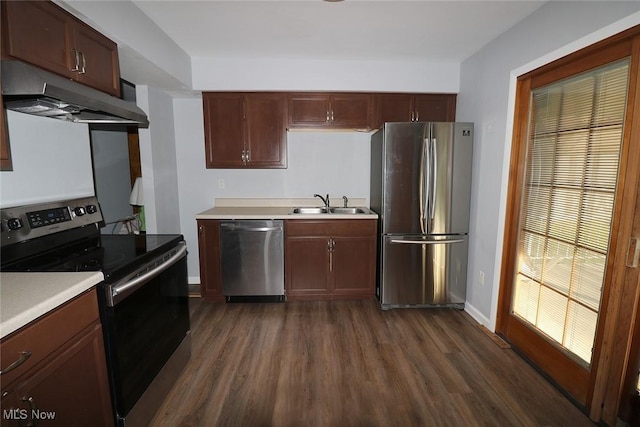 kitchen featuring stainless steel appliances, dark hardwood / wood-style floors, and sink