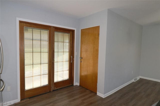 entryway with dark wood-type flooring