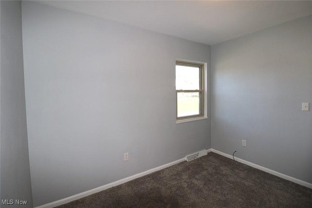 spare room featuring carpet flooring