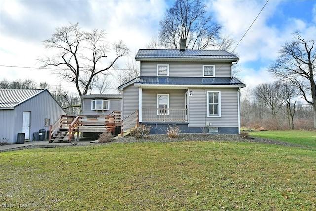 view of front of house with a front yard and a porch