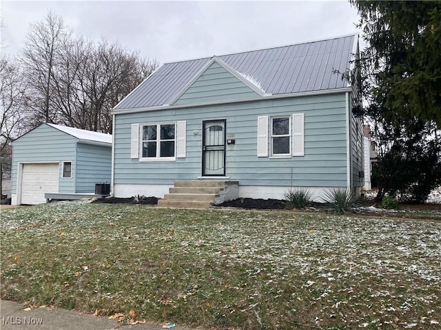 view of front of property with central air condition unit and a front lawn