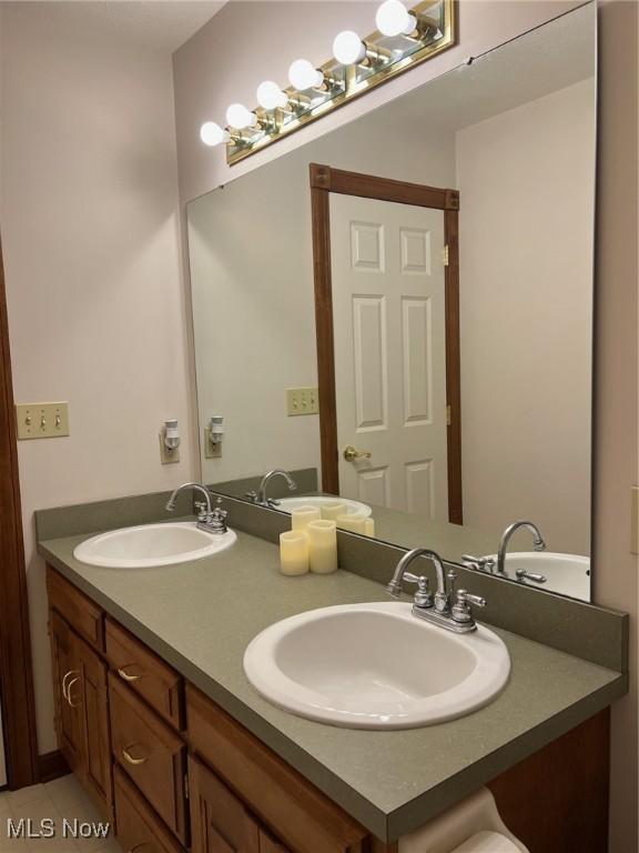 bathroom featuring tile patterned floors and vanity