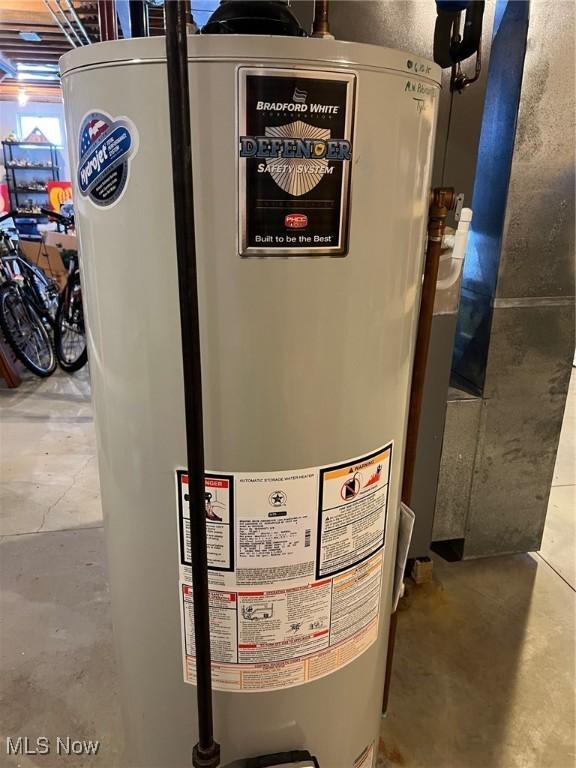 utility room featuring gas water heater