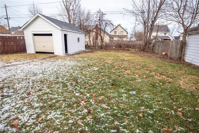 view of yard featuring an outbuilding and a garage