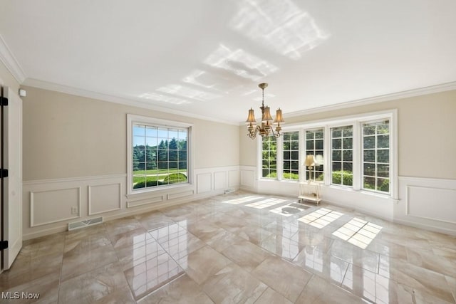 unfurnished dining area with ornamental molding, a wealth of natural light, and a chandelier