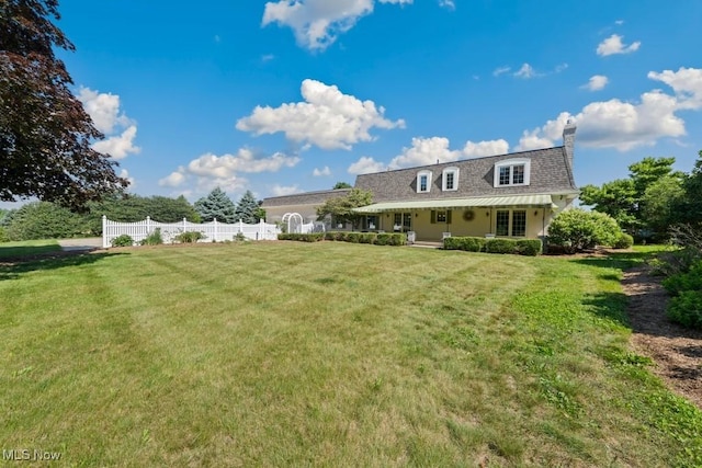 view of front of home with a porch and a front lawn