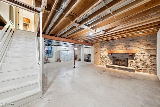 basement with a stone fireplace