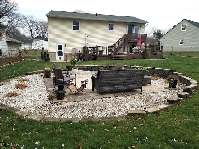 back of house with a patio area, a yard, a deck, and a fenced backyard