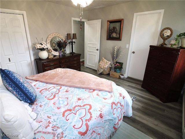 bedroom featuring a closet and wood finished floors