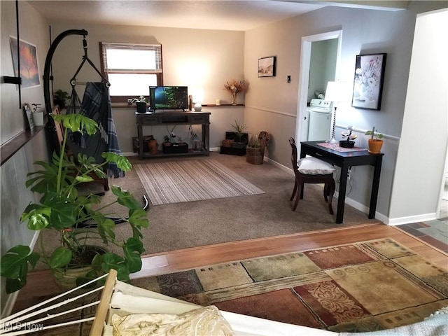 living room featuring baseboards and wood finished floors