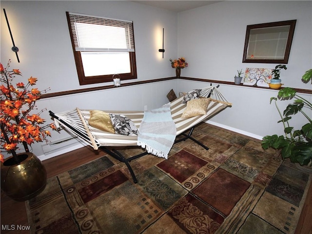 interior space featuring wainscoting and wood finished floors