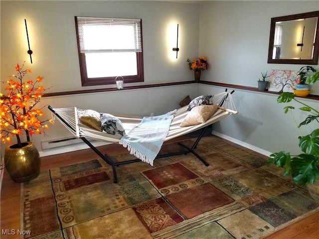 living area featuring baseboards