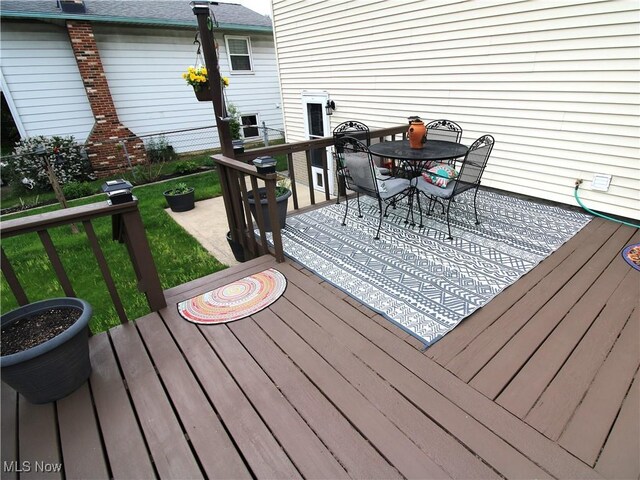 109 Meadowfield Ct, Elyria, OH 44035 - deck featuring outdoor dining area and a lawn