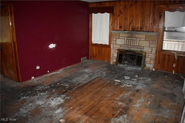 unfurnished living room featuring hardwood / wood-style flooring and a fireplace