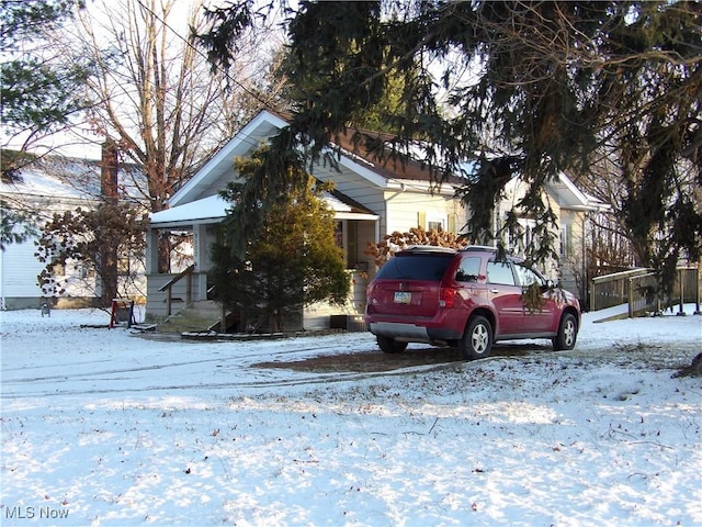 view of property hidden behind natural elements