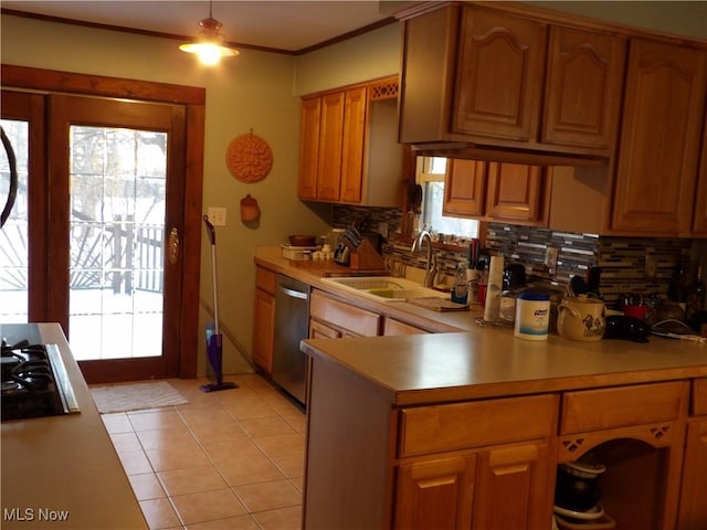 kitchen with sink, gas stovetop, stainless steel dishwasher, backsplash, and light tile patterned floors