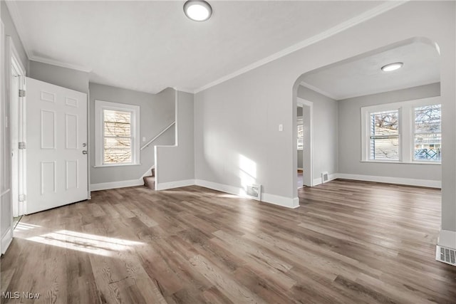 foyer featuring hardwood / wood-style floors and ornamental molding