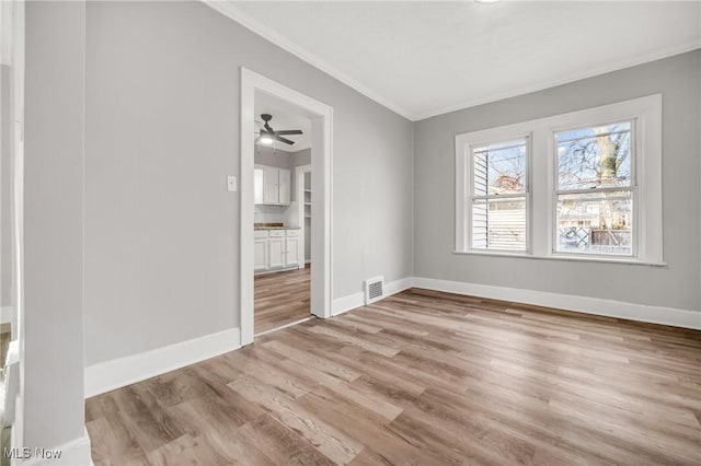 interior space featuring light hardwood / wood-style floors and ornamental molding