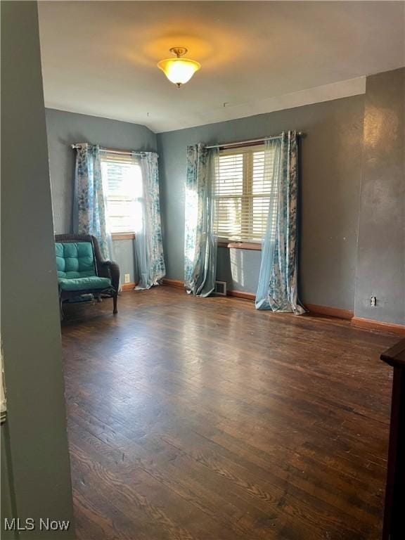 spare room featuring dark hardwood / wood-style flooring