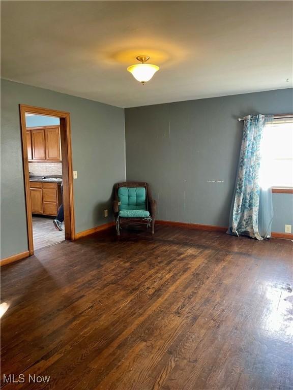 unfurnished room featuring dark hardwood / wood-style flooring